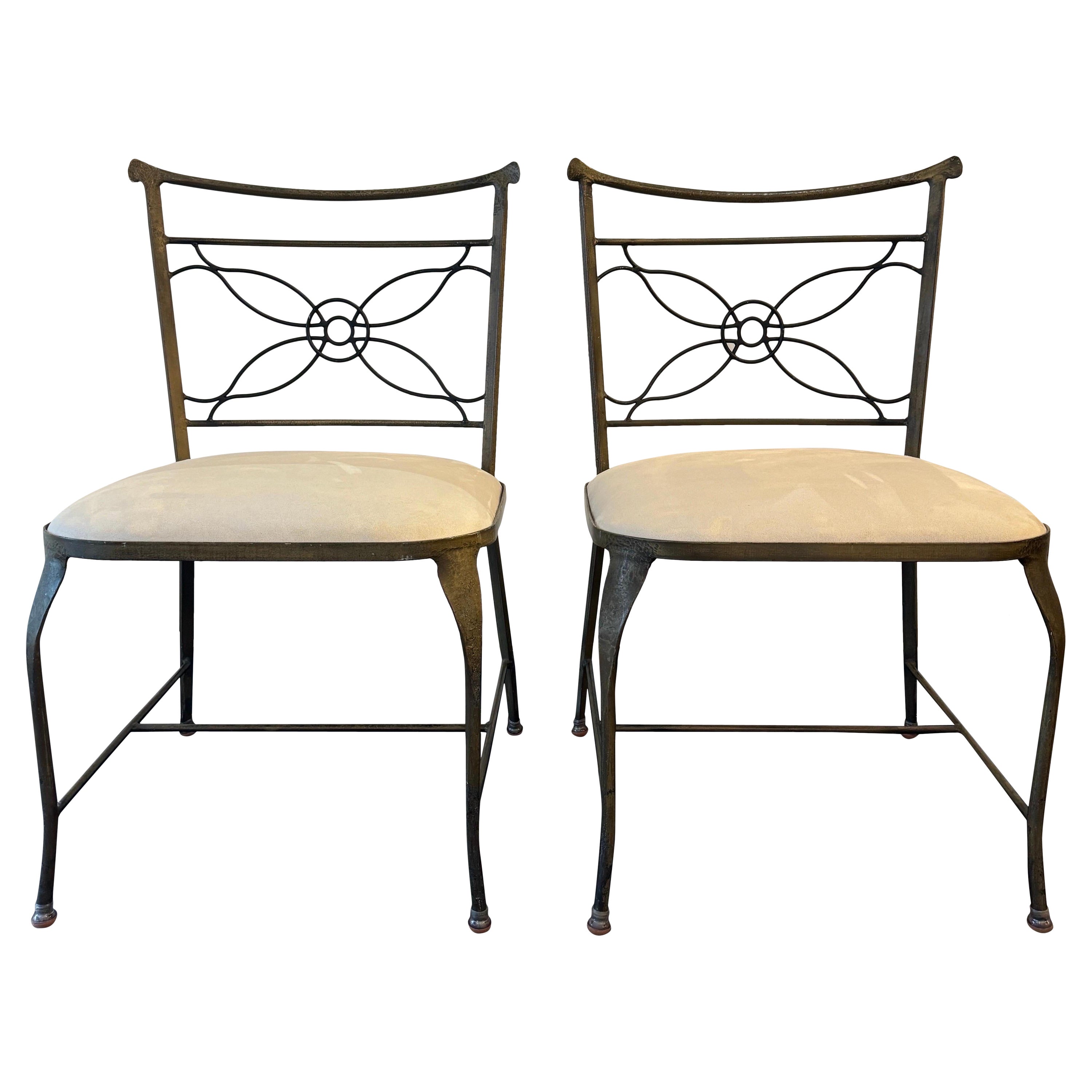 A rare pair of Rene Prou wrought iron occasional chairs
