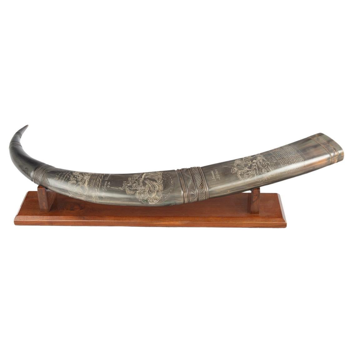 A rare scrimshaw decorated horn attributed to C.H. Wood