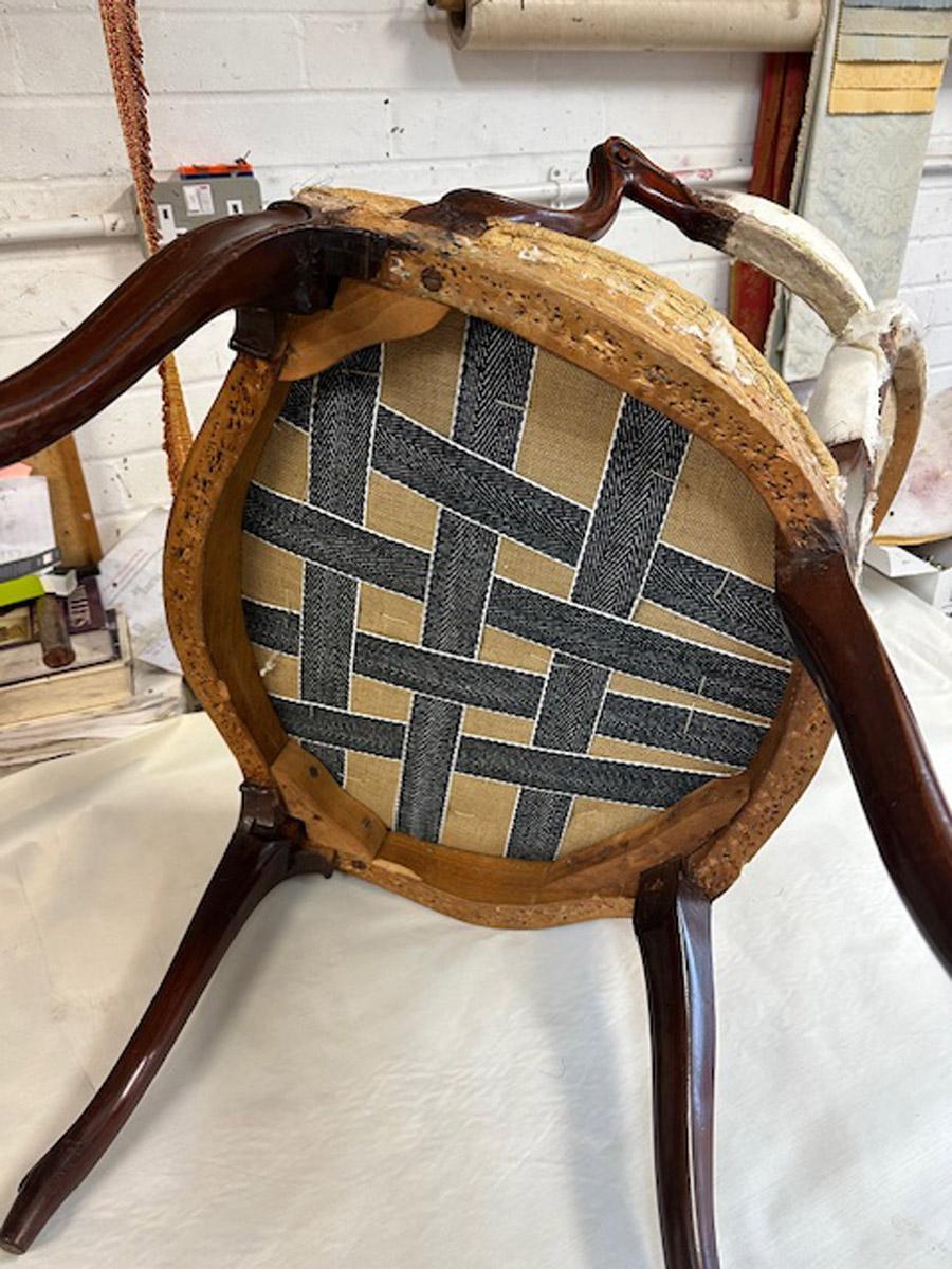 A rare set of twelve George III mahogany open arm chairs in the French Hepplewhi For Sale 10