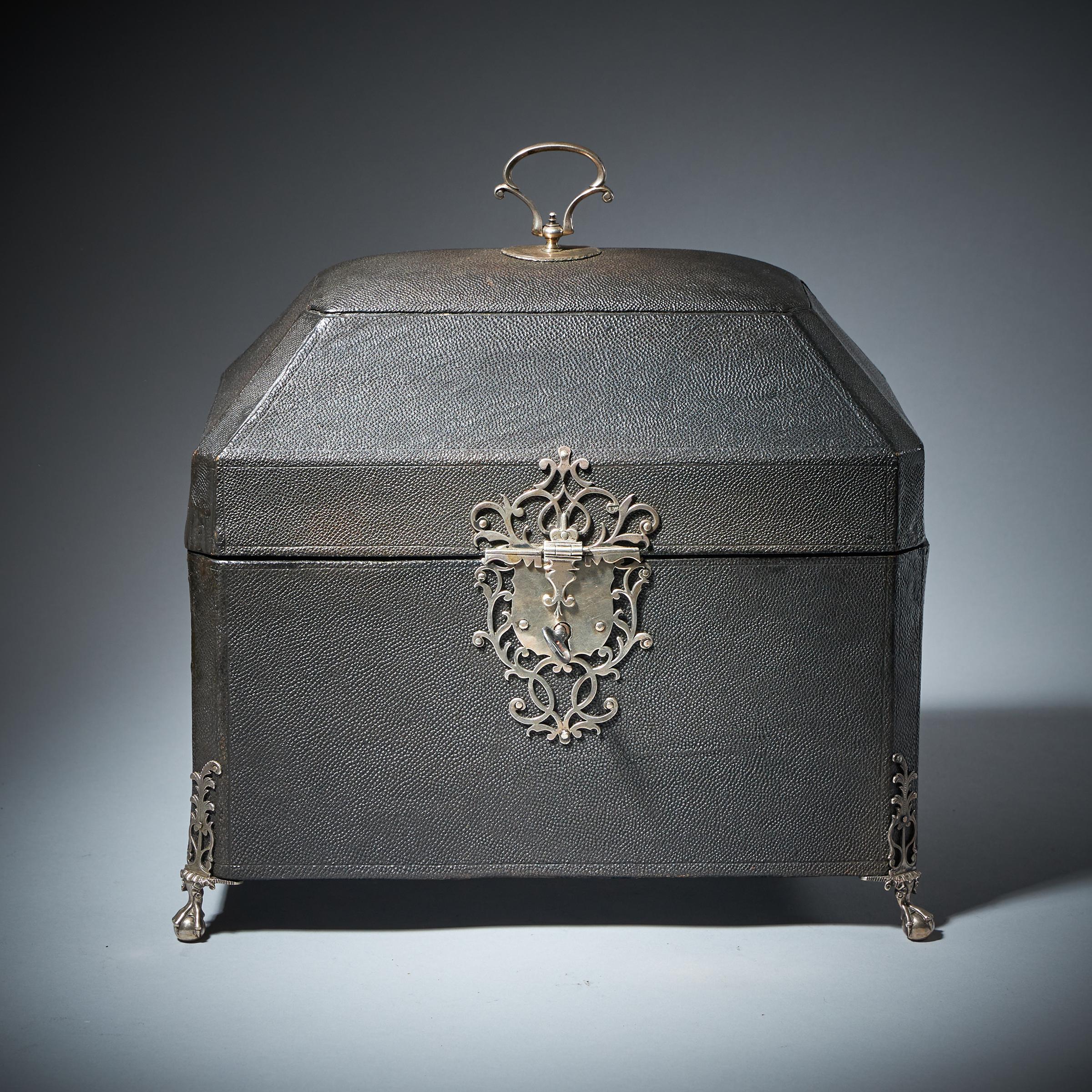 A fine pair of George III silver Rocco tea caddies by Francis Butty & Nicholas Dumee, dated 1766, housed in a silver mounted shagreen case. 

Each of the silver Rocco baluster gadrooned caddies is beautifully worked by silver smiths Francis Butty