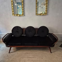 A rare stylish sofa by, Midcentury Modern. Re-upholstered in black velvet.