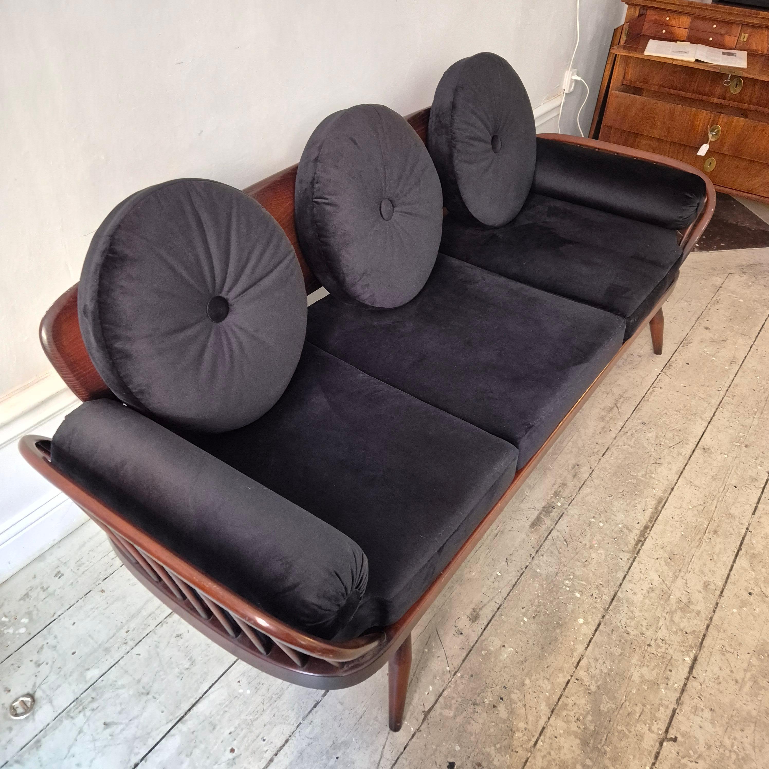 English A rare stylish sofa by, Midcentury Modern. Re-upholstered in black velvet. For Sale