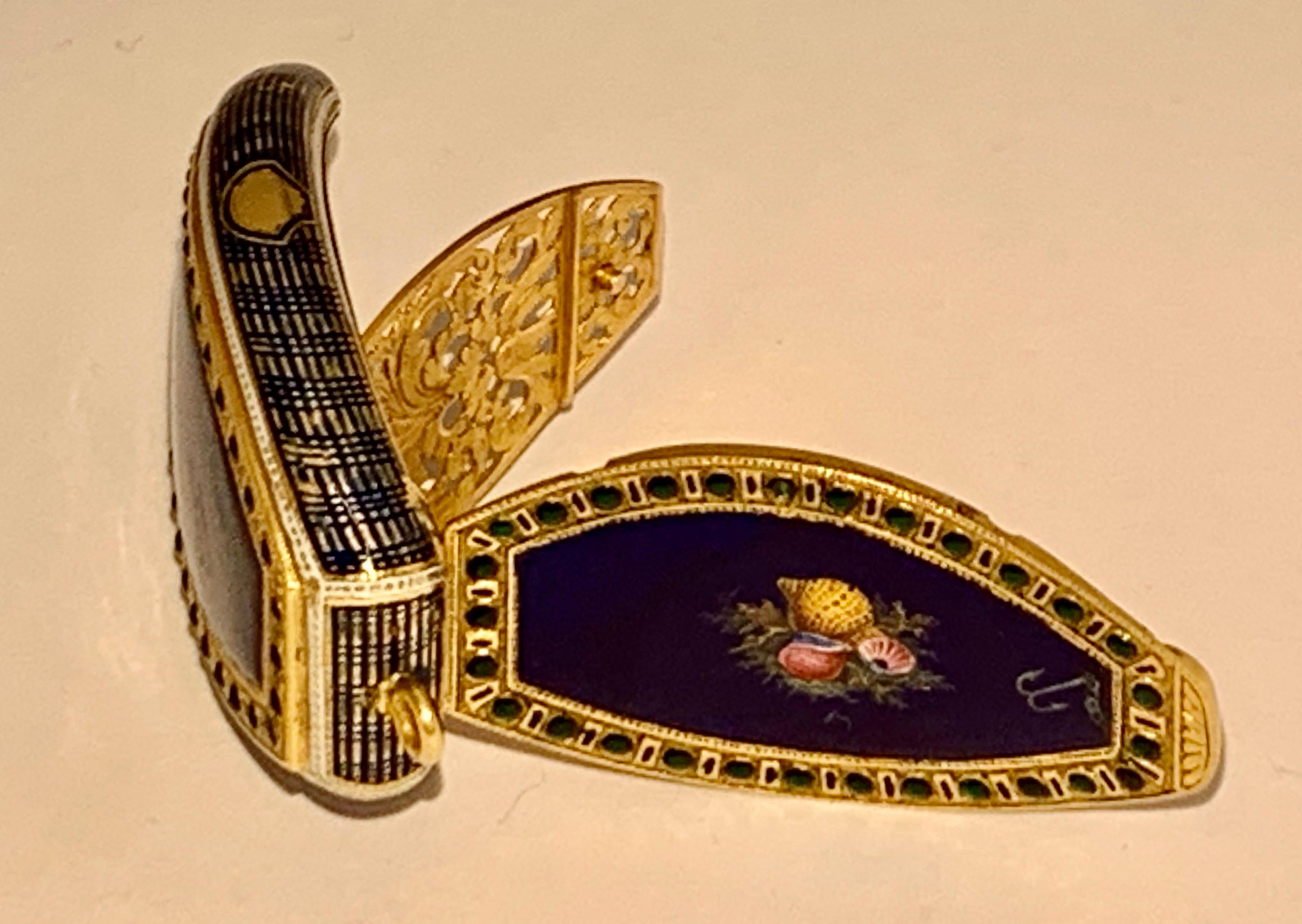 Thanks for looking at this superb object of virtue.
This Box is In the form of a Boat, the cover and base of translucent blue enamel on a peacock-feather engine-turned ground, the cover further enamelled with a variety of sea shells on a grass bank
