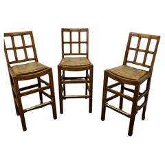 A Rare Trio of Arts and Crafts High Bar Stools, in Golden Oak  