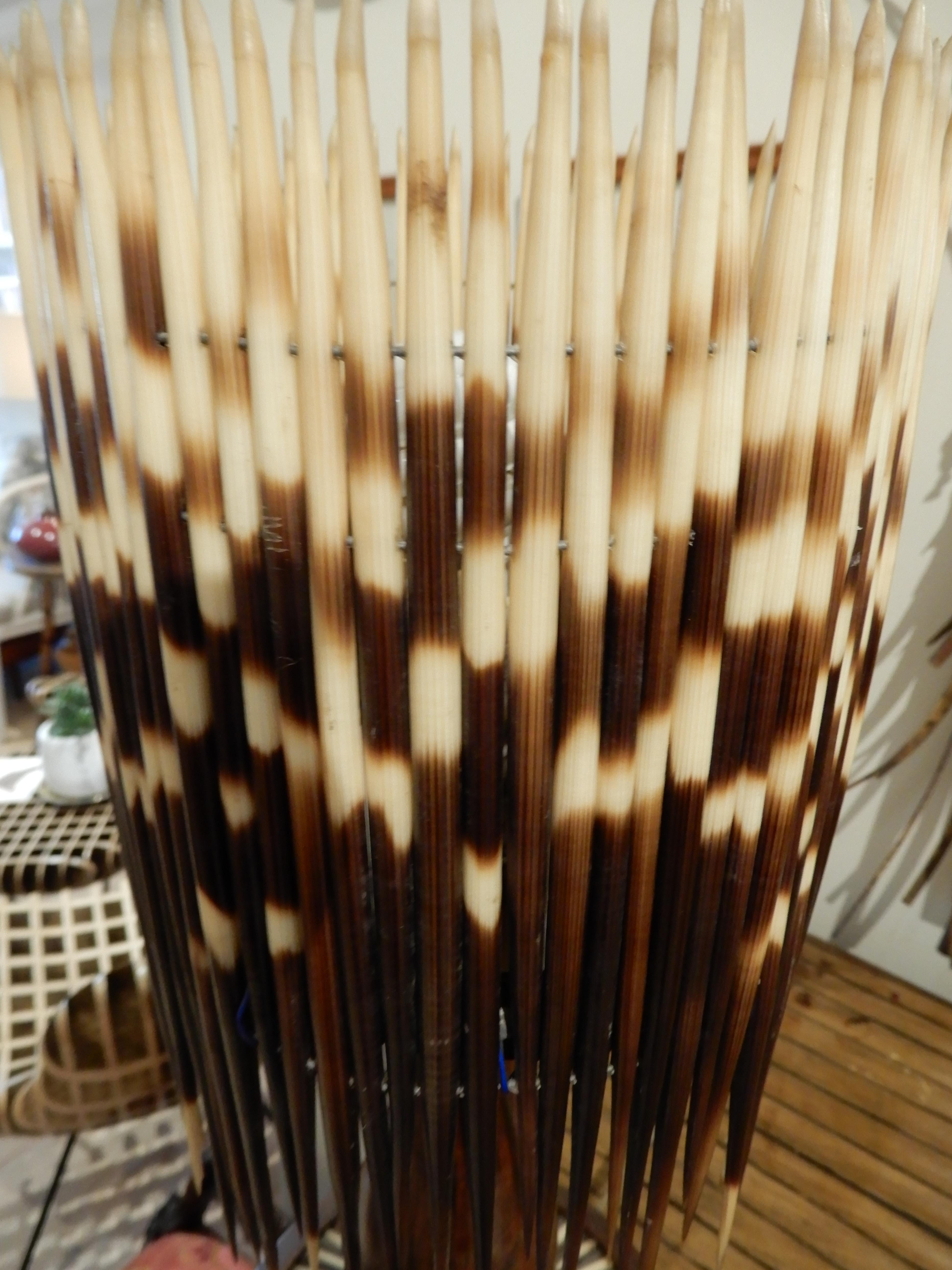 Decorating with the natural beauty of Porcupine Quills has a unique affect, the light has a warm glow through the quills.
This rare find was probably a custom made piece, with solid walnut woods, porcupine quill inlays and quill shade.