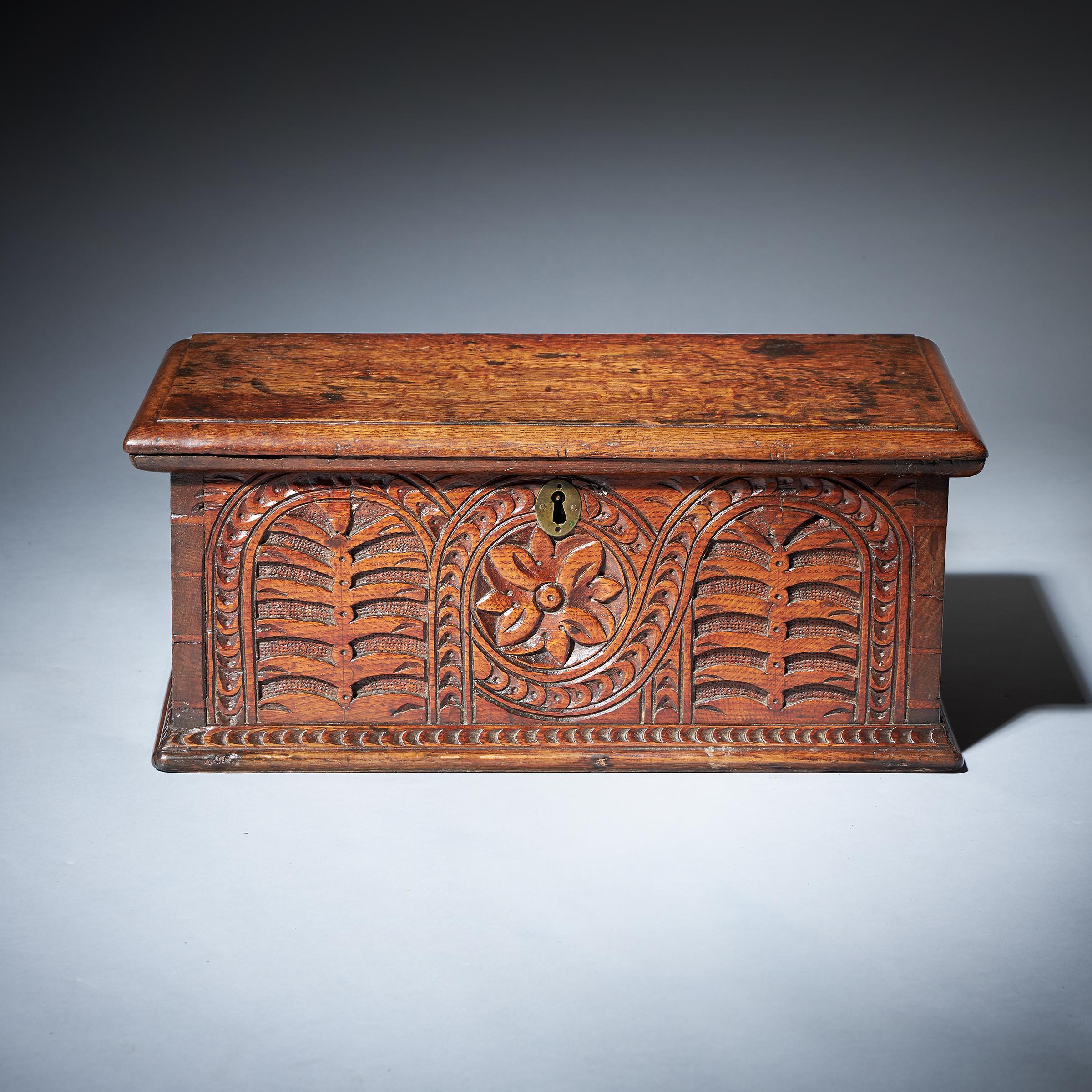 A very charming 17th-century oak deeds box with deep carved decoration to the freize. The box is very well made for the period with visible through dovetails. 

Originally the box would have had two locks, one to the left and one to the right-hand