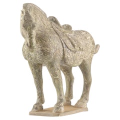 Un raro caballo de cerámica jaspeada con reflejos amarillos Un raro caballo de cerámica jaspeada con reflejos amarillos