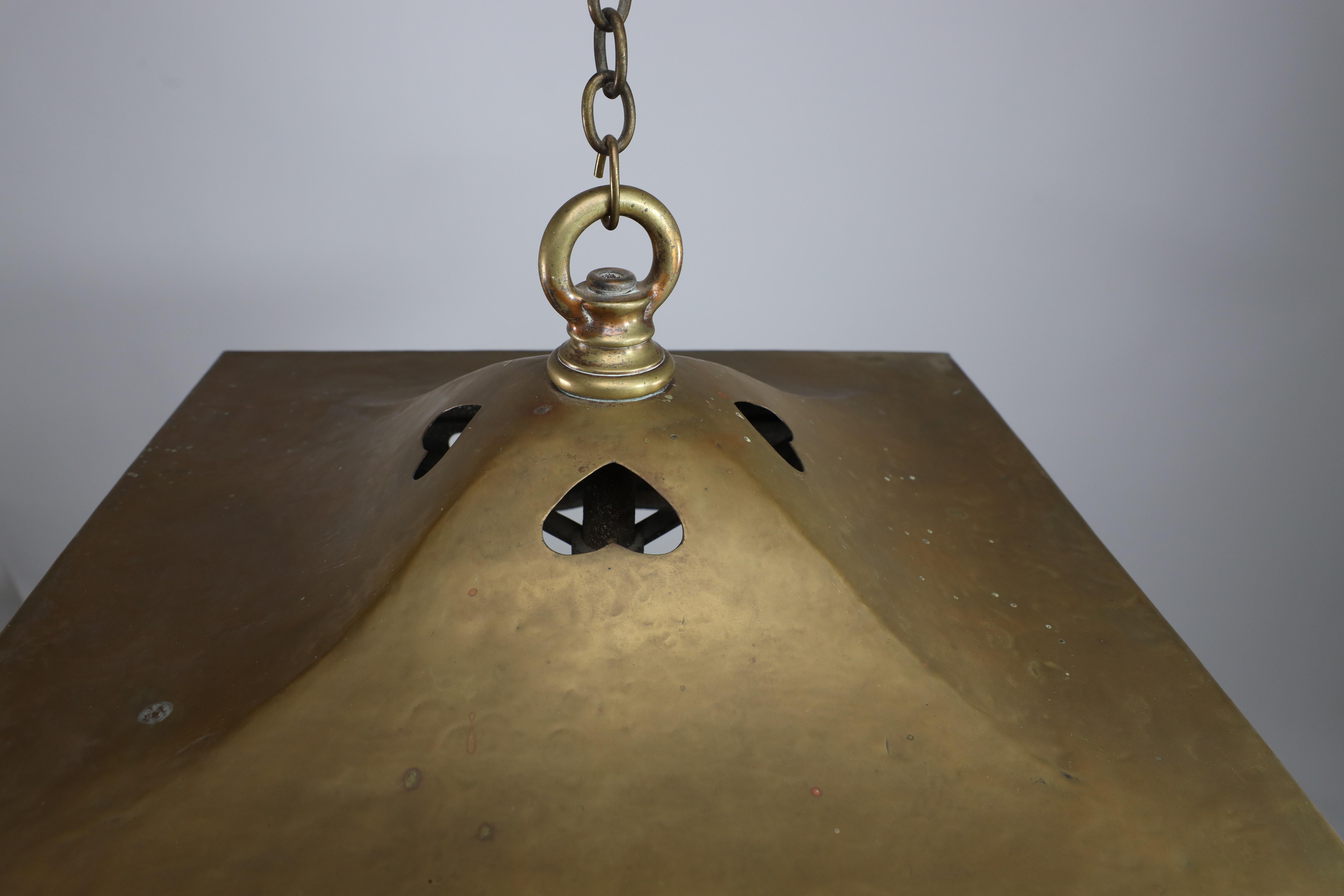English A big Arts and Crafts brass lantern with a domed flaring hat pierced with hearts For Sale