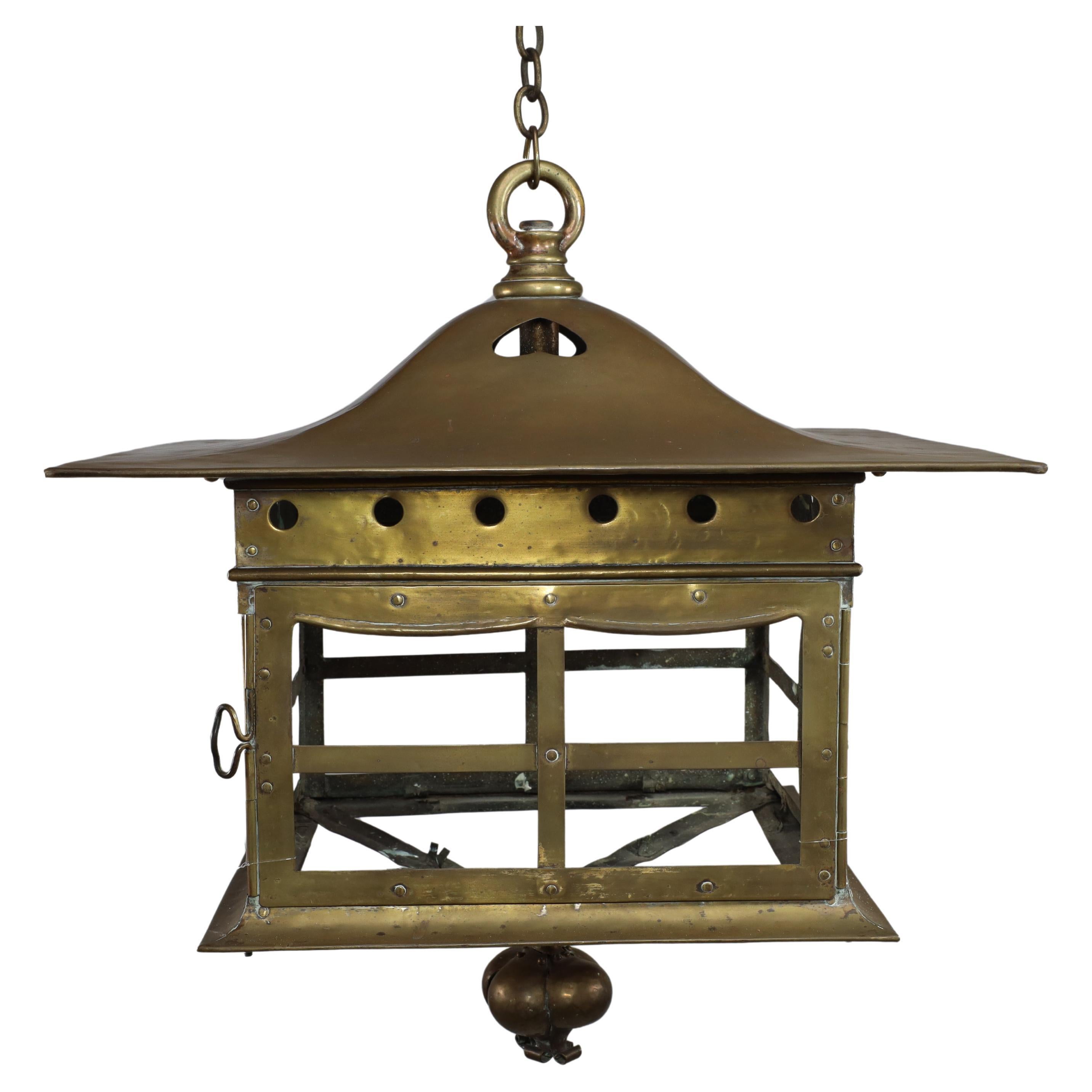 A big Arts and Crafts brass lantern with a domed flaring hat pierced with hearts For Sale