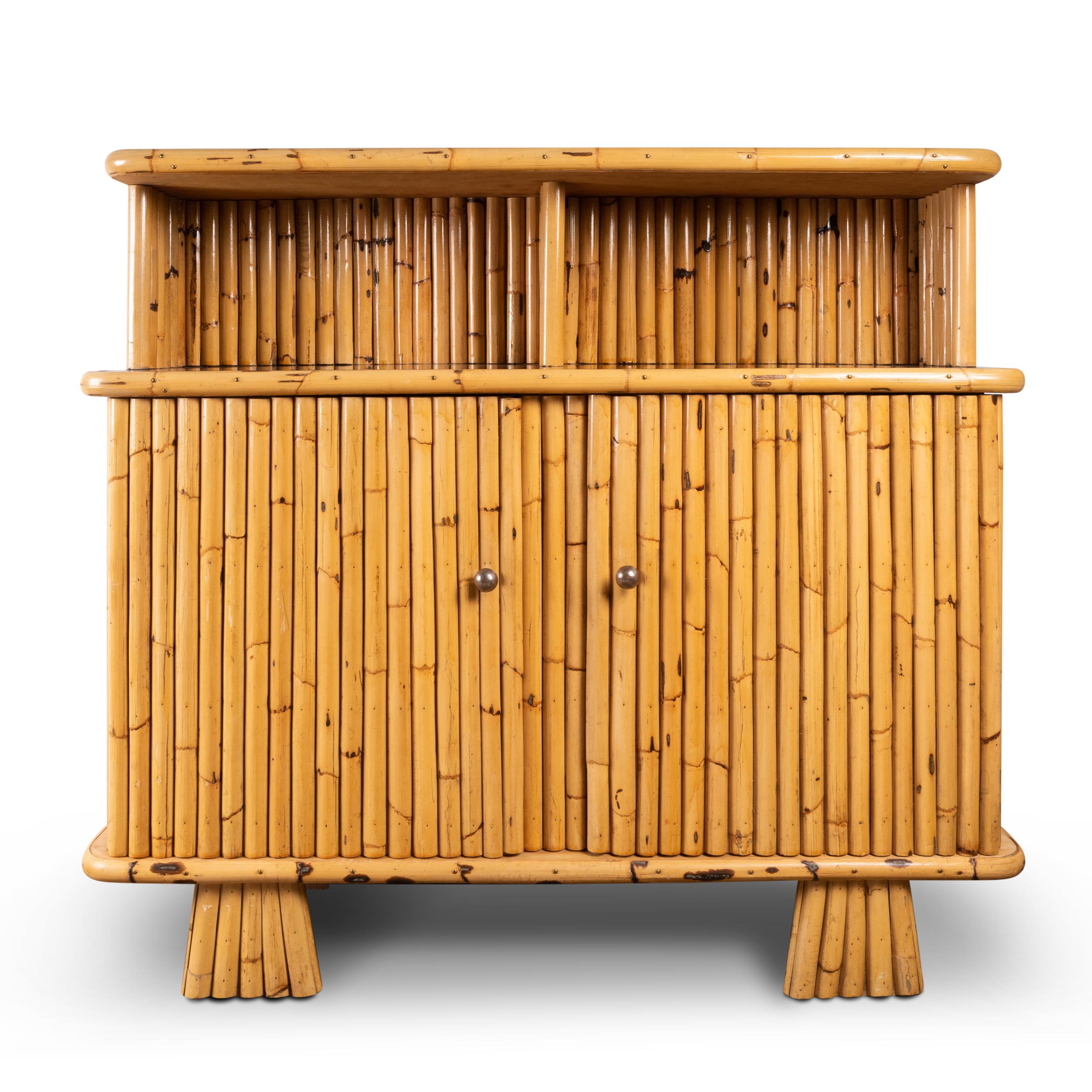 Rattan buffet opening with 2 doors.
With two black lacquered shelves
South of France, 
Circa 1970. 
This well proportioned buffet evokes the 