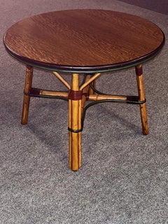 A rattan coffee table in natural finish / colored trim and quarter sawn oak top