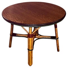 A rattan coffee table in natural finish / colored trim and quarter sawn oak top