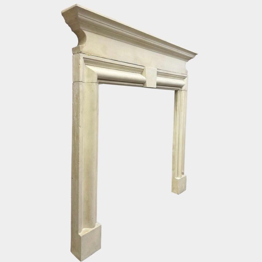 English A Reclaimed 18th Century Style Bolection Stone Fireplace Mantel For Sale