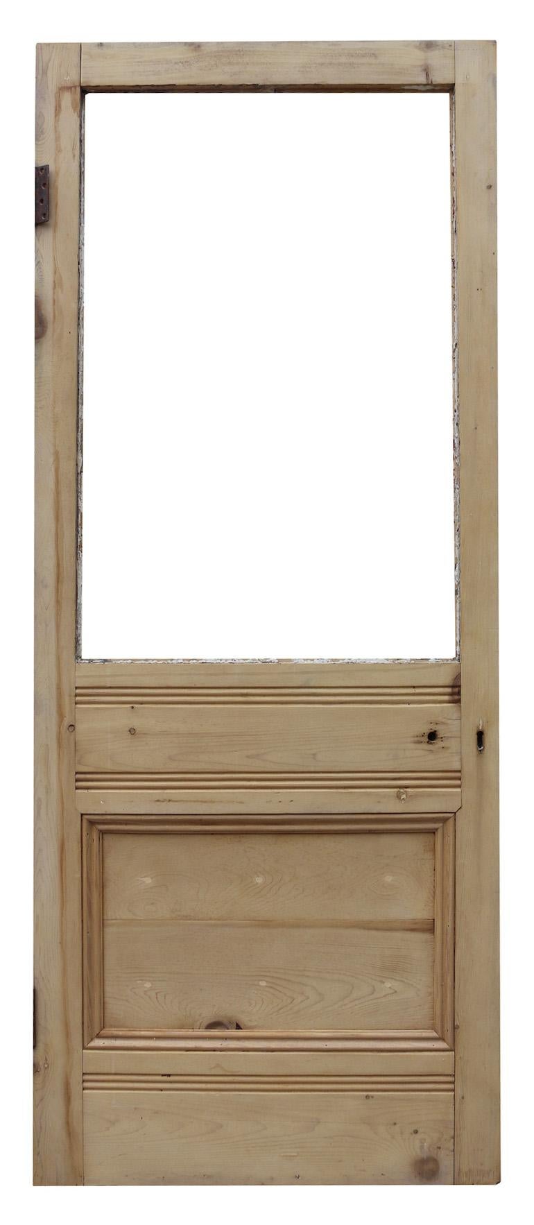An English exterior door for glazing, with a stripped and sanded finish.