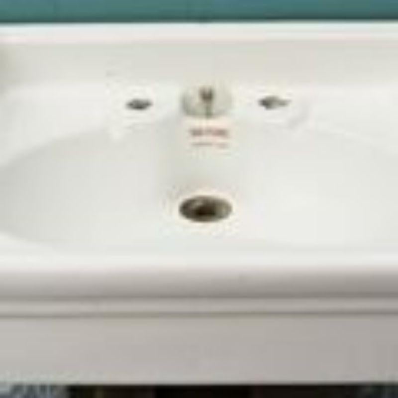 An antique English bathroom sink for surface or bracket mounting, circa 1900. There are no taps.