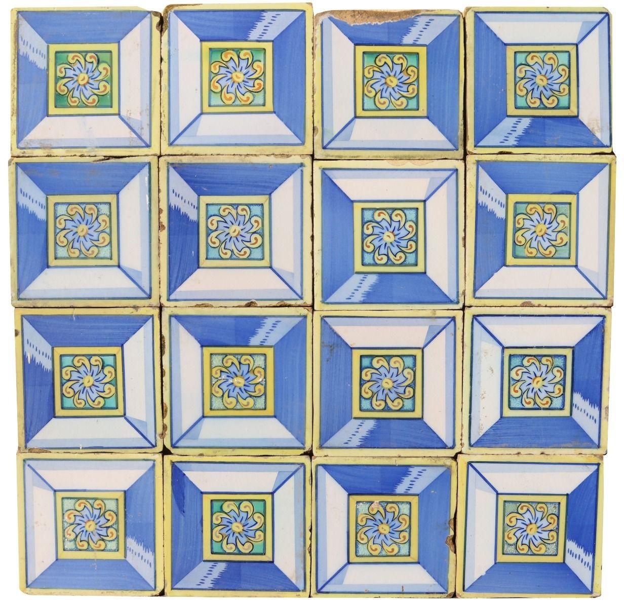 A reclaimed tile panel consisting of 17 glazed ceramic tiles decorated in blue and yellow. This could be used as a splash back, or wall decoration. Overall size of panel as pictured 60 x 60 cm (23.62 x 23.62 in)