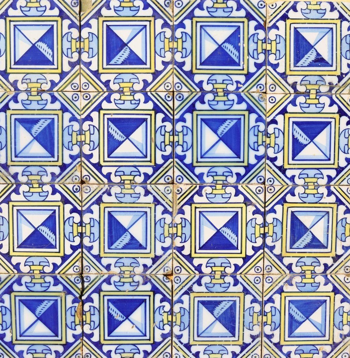 A reclaimed tile panel consisting of 16 glazed ceramic tiles decorated in blue and yellow. There are a further 9 tiles included, but not shown. This could be used as a splash back, or wall decoration. Overall size of panel as pictured 60 x 60 cm