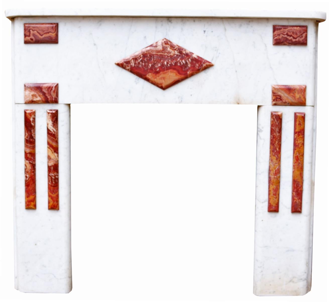 An early 20th century French marble fireplace.

Additional Dimensions:

Opening Height 68 cm

Opening Width  65.5 cm

Width between outside of legs 110 cm.