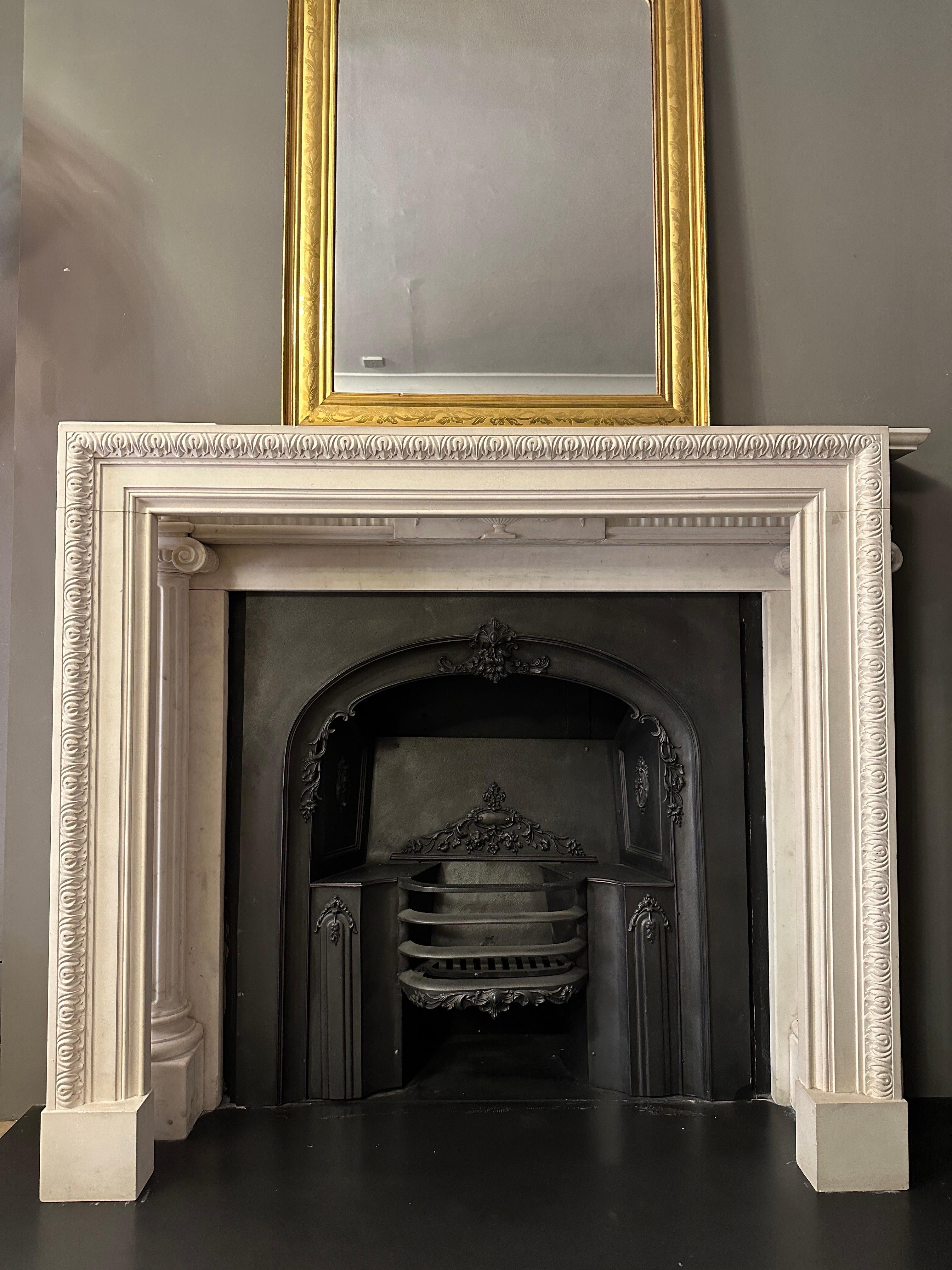 An attractive stone fireplace in the Georgian manner with lambs tongue carved to outer edge and steeped moulding to inner. Stood on square plinth foot blockings. Reclaimed from a London apartment. 

Opening sizes 101cm x 101cm 