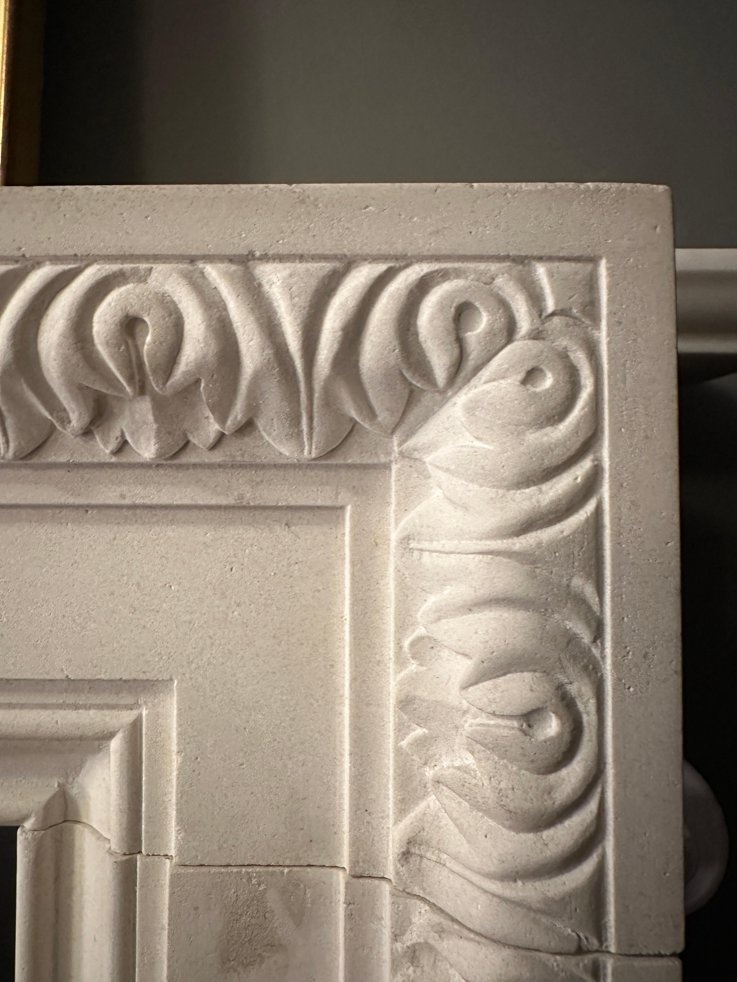 Hand-Carved A Reclaimed George II Style English Fireplace Mantel In Limestone For Sale