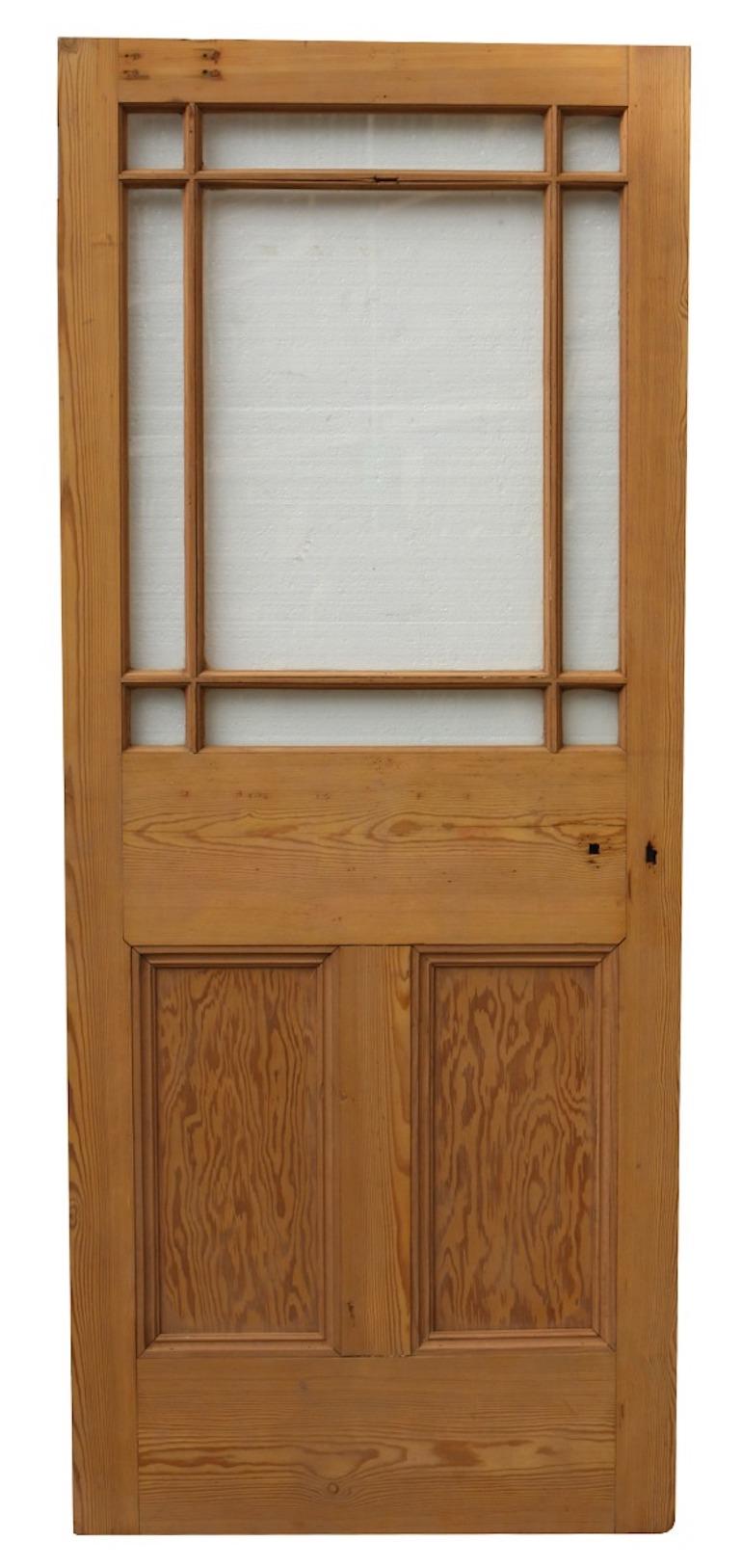 A margin glazed door constructed from pine, fitted with complete clear single glazing.