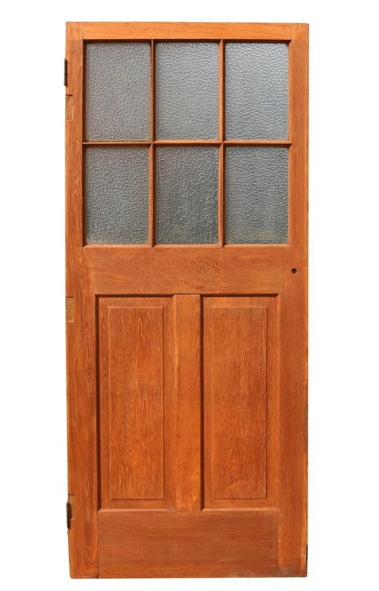 A reclaimed teak door, originally from the offices of a tea importers warehouse.