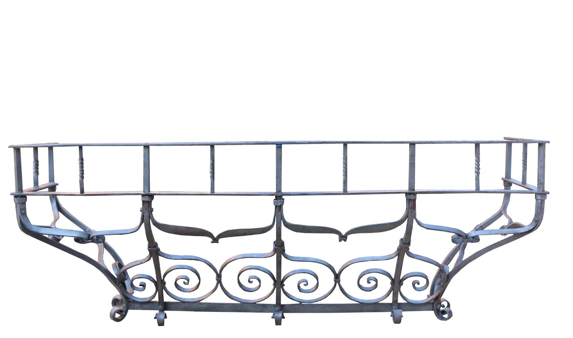 A reclaimed iron balcony salvaged from a house in Egham.