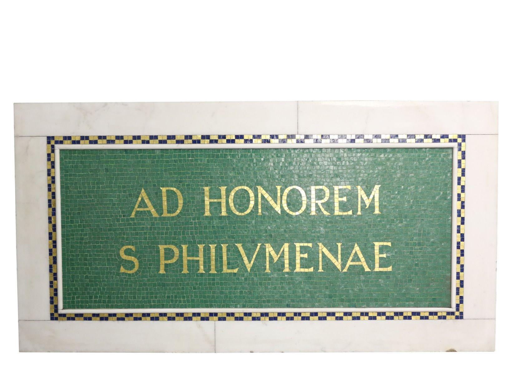 This plaque was salvaged from a property in Bristol. The Latin translates as 'In Honour of Saint Philomena'