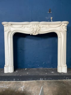 A Reclaimed Rococo French Style Marble Fireplace Mantel