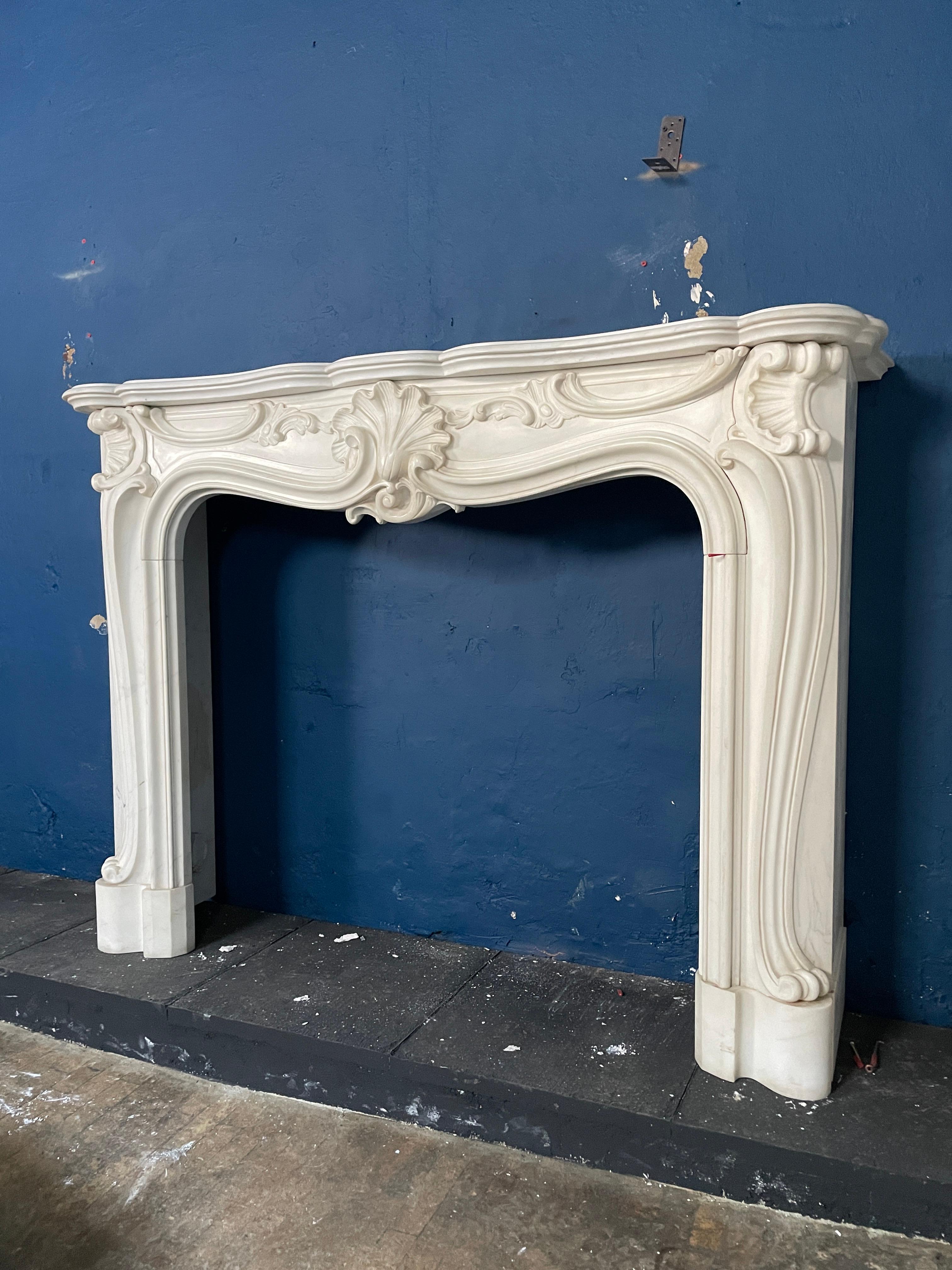 European A Reclaimed Rococo French Style Marble Fireplace Mantel  For Sale