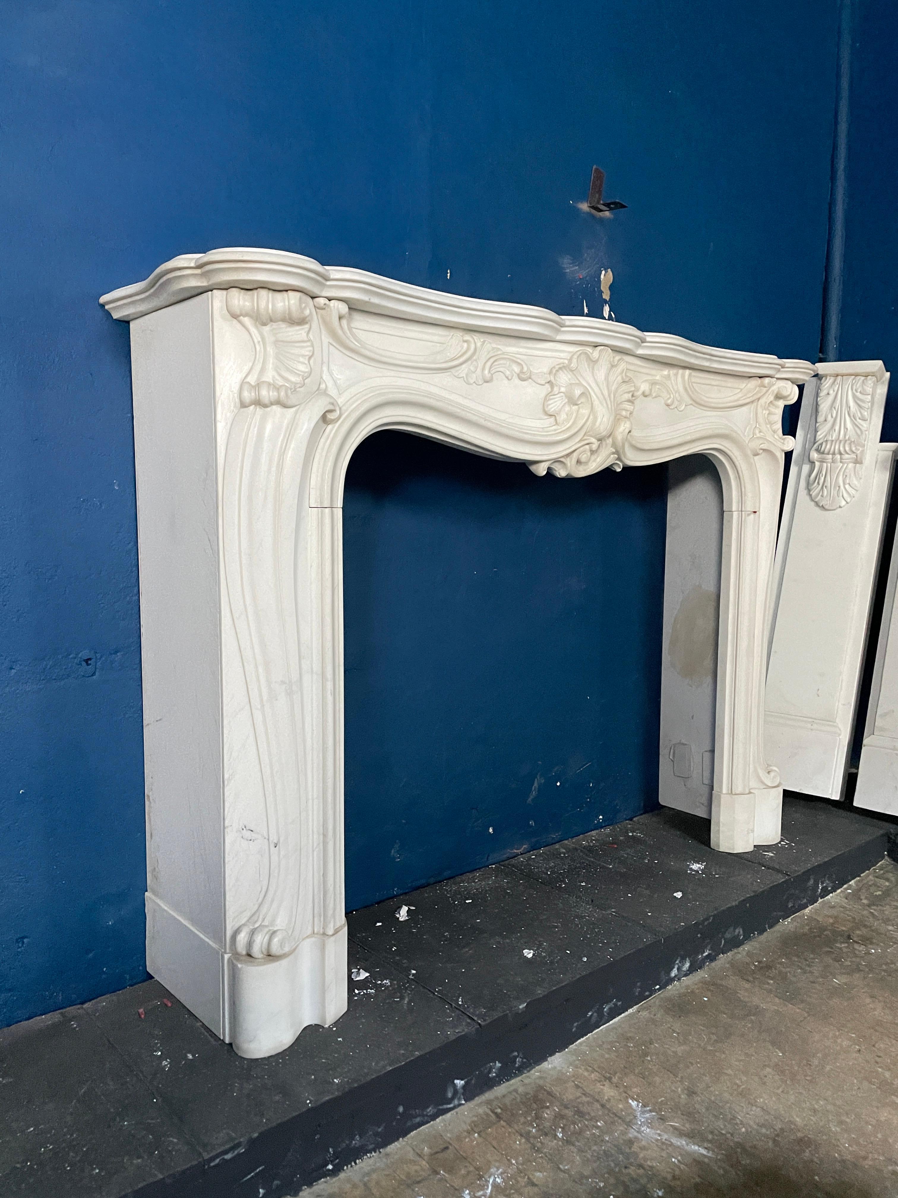 A Reclaimed Rococo French Style Marble Fireplace Mantel  In Good Condition For Sale In London, GB