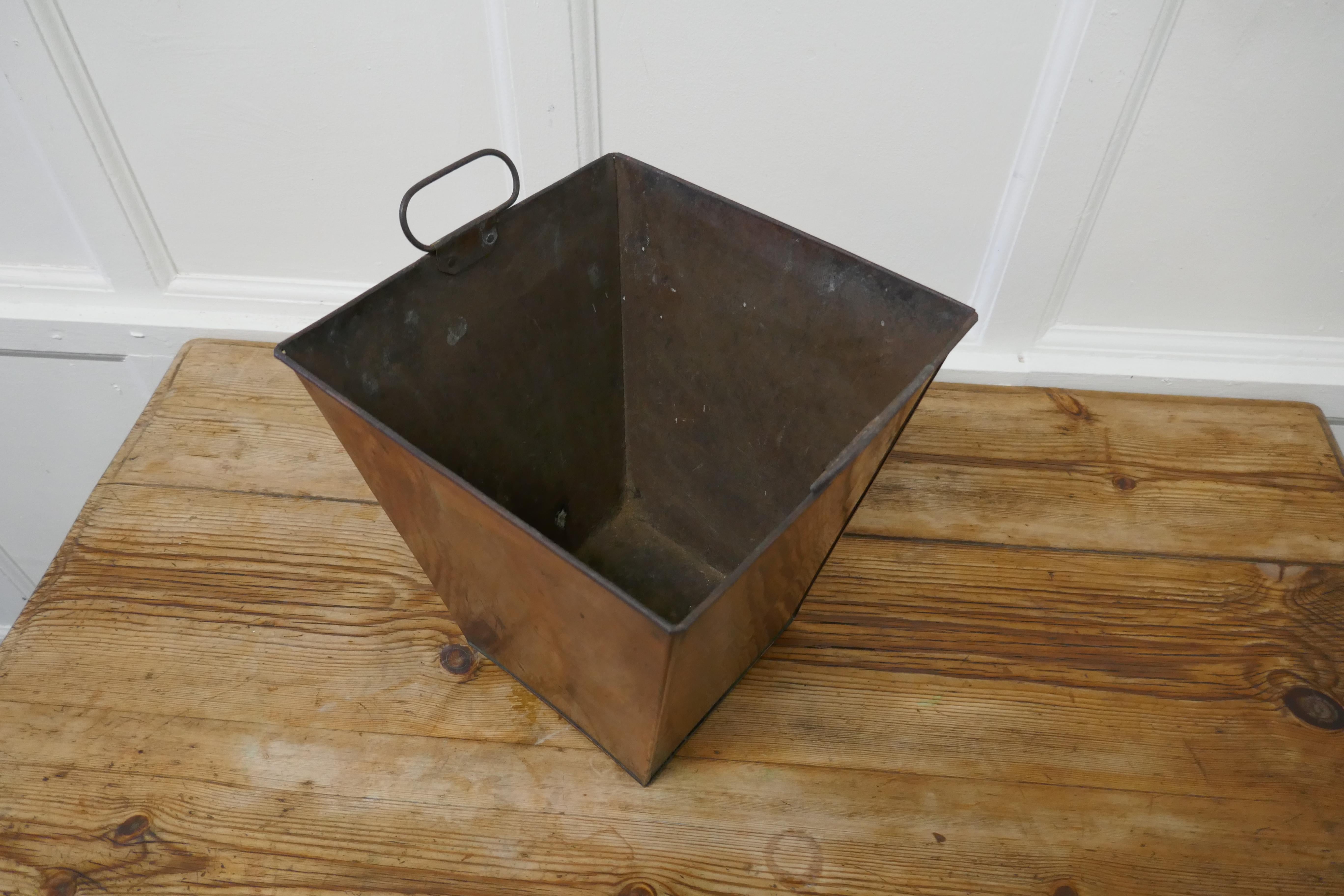 A rectangular copper waste paper bin

This one has been used as a waste paper basket it has small inside handles, it has many other uses, perhaps a coal box or umbrella stand?
The copper bin is 12” high and 11 inches square
GB498.
