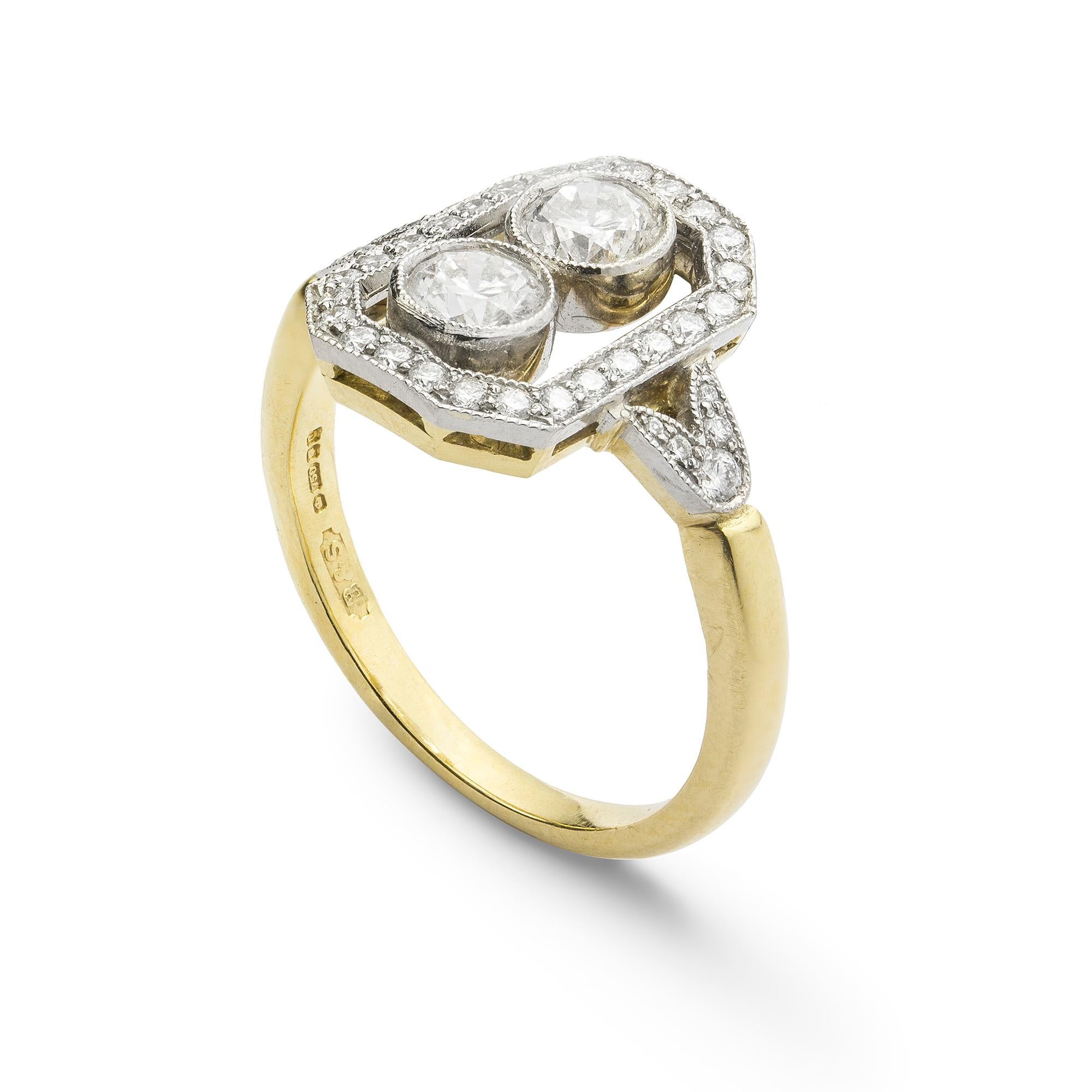 A rectangular diamond plaque ring, the ring set to the centre with two brilliant-cut diamonds weighing a total of 0.52 carats, millegrain rubover-set within an openwork rectangular plaque, set throughout with round brilliant-cut diamonds, with round
