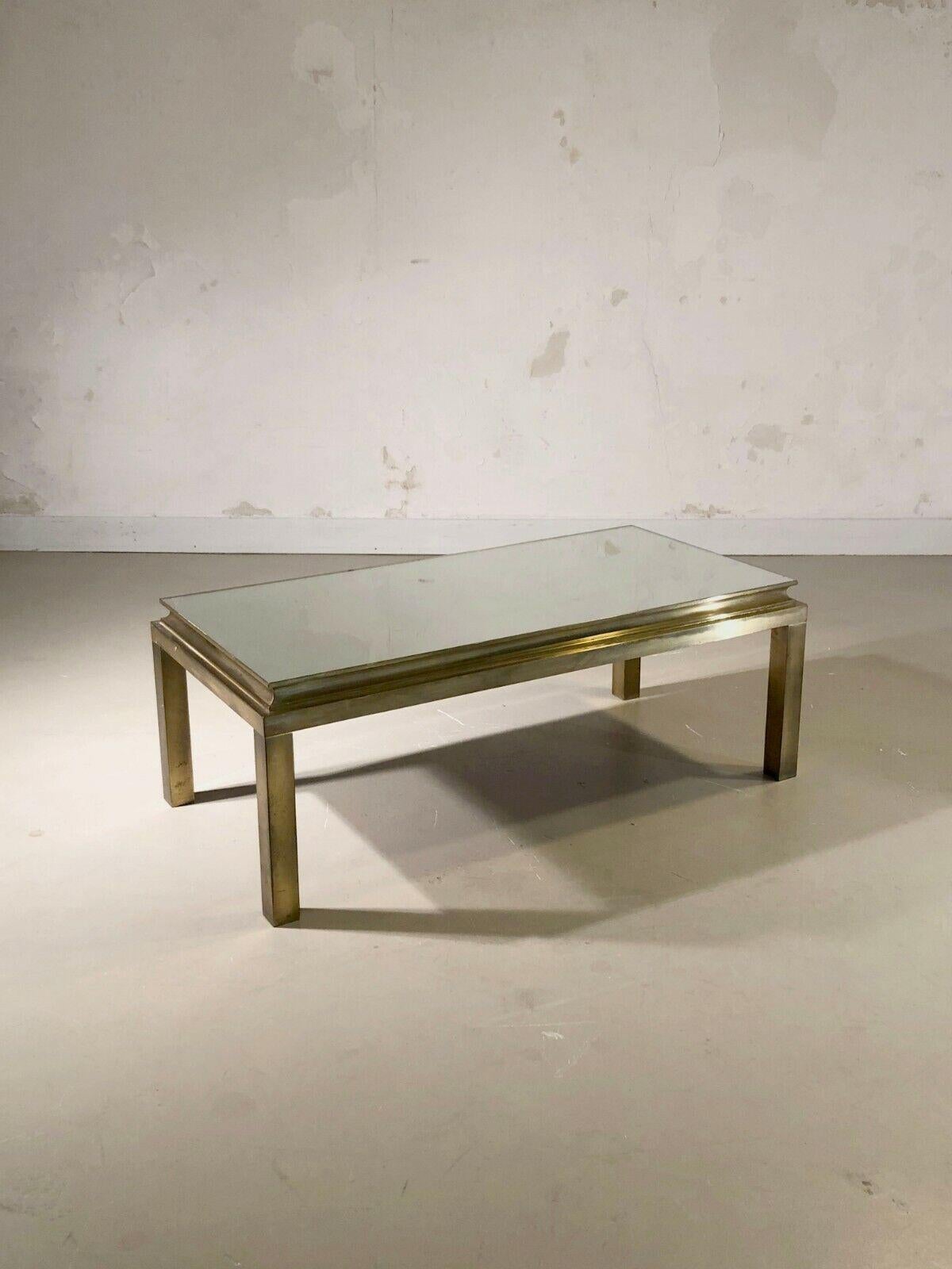 An elegant and luxurious rectangular coffee table, Art-Deco, Post-Modernist, Neo-Classical, square section base and stepped ornament supporting an old mercury mirror glass top, Maison Jansen, France 1970.