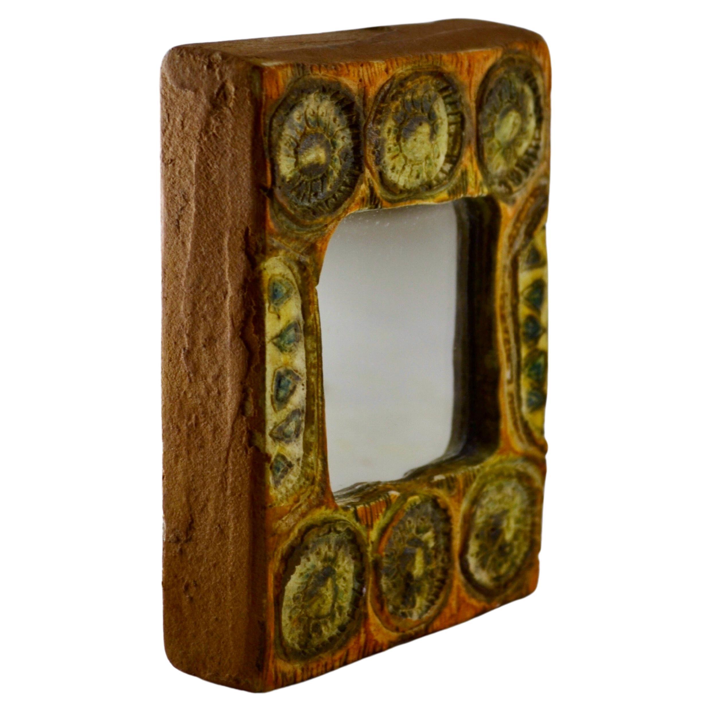 A magnificent rectangular wall mirror from the 60s, crafted in talosel with a subtly decorated border. In the style of the work of Line Vautrin and Juliette Derel, this mirror combines elegance and sophistication. Its unique design and delicate