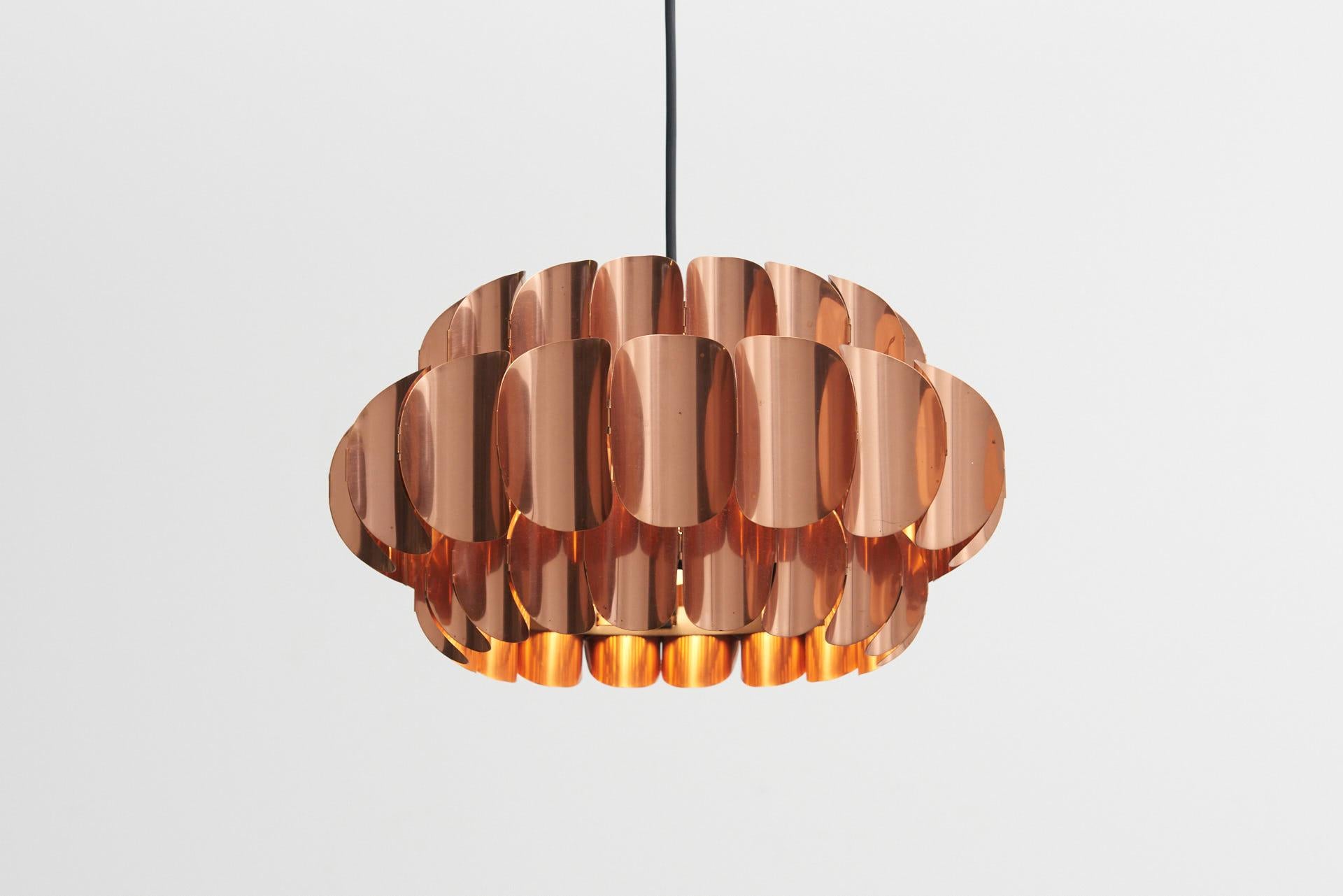 A red copper leaf suspension lamp, designed by Thorsten Orrling in the 1960s. Produced by Markaryd in Sweden.
