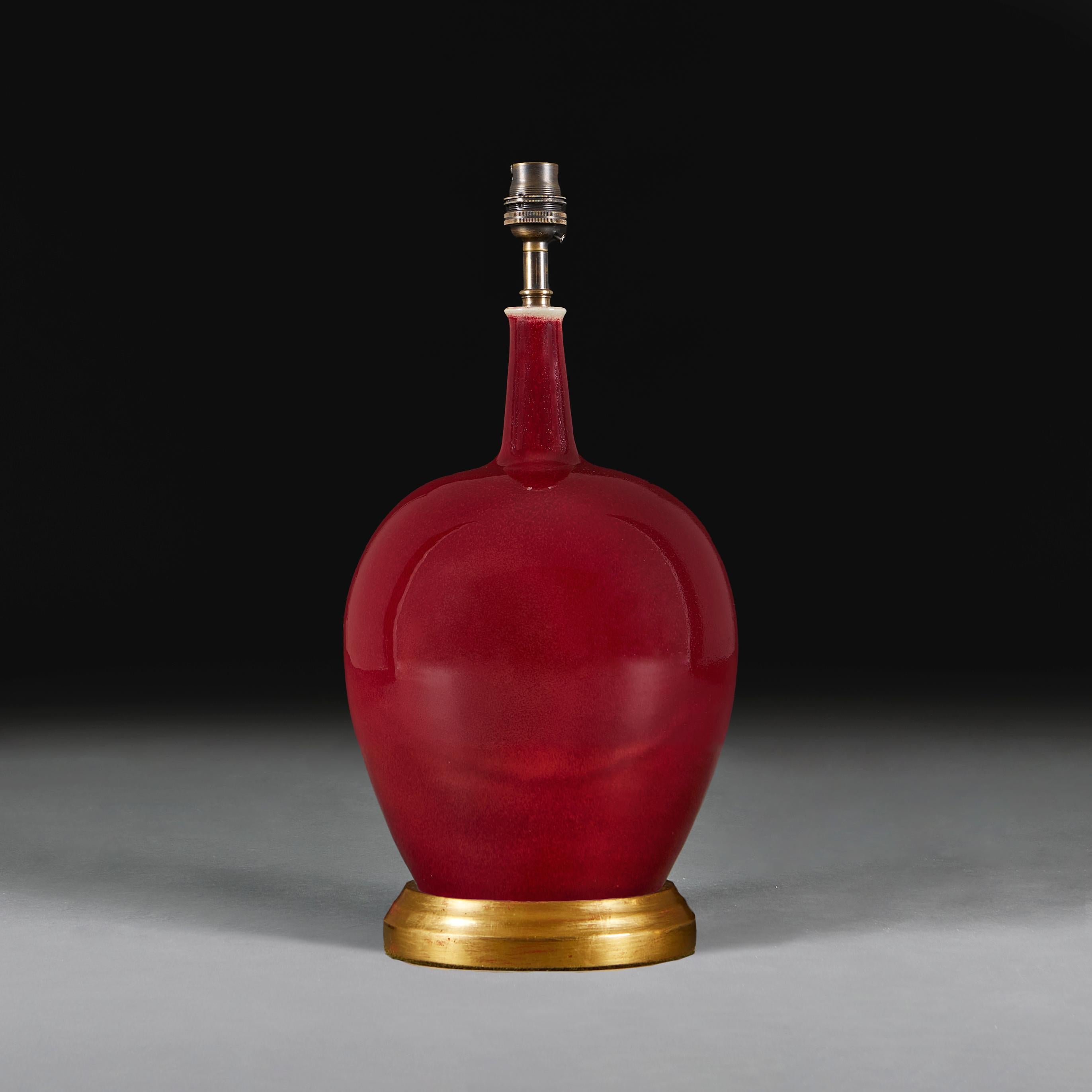 Chinese A Red Flambe Mei Ping Vase as a Table Lamp with Giltwood Base For Sale