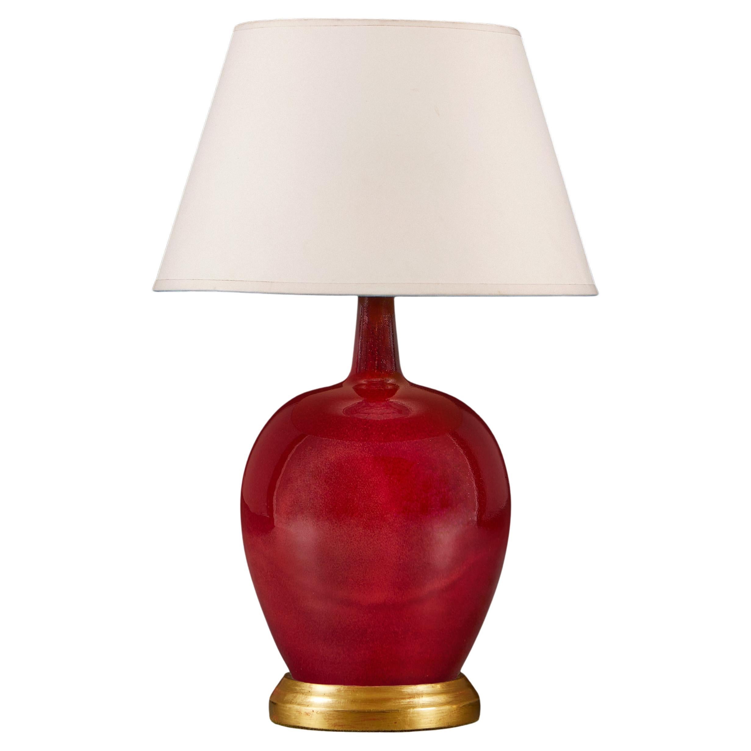 A Red Flambe Mei Ping Vase as a Table Lamp with Giltwood Base For Sale