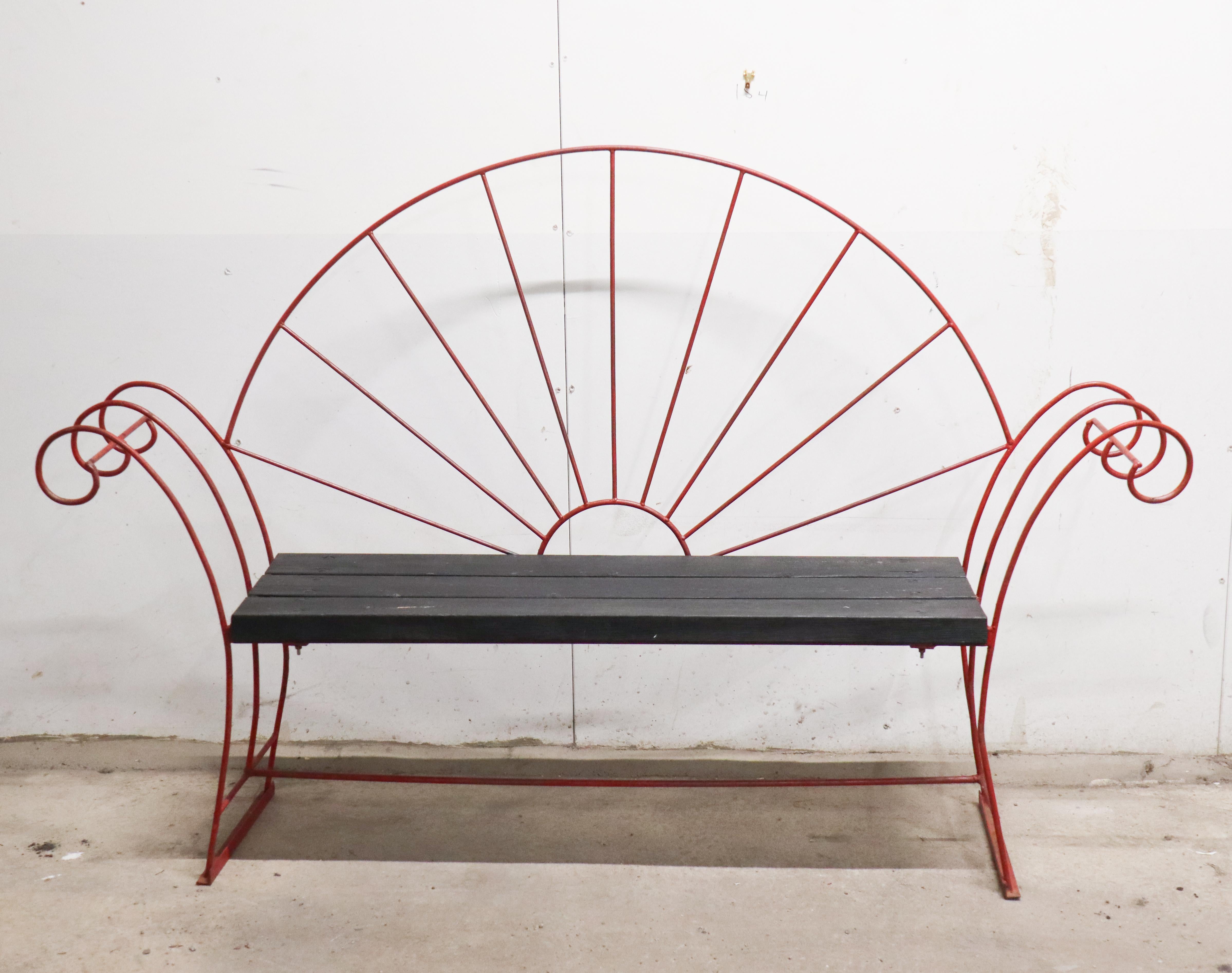 A stunning garden sofa probably design in Sweden in the early 20th century. The sofa is made of wrought iron and wood. It is a really unique design and I have never seen anything like this before. The sofa is painted red, I´m not sure if that is the