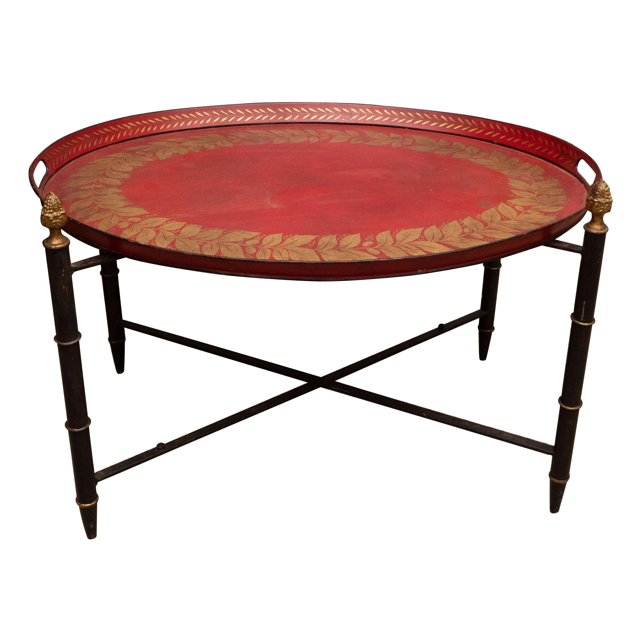 Red Tole Table with Decorative Oval Top and X-Frame Base