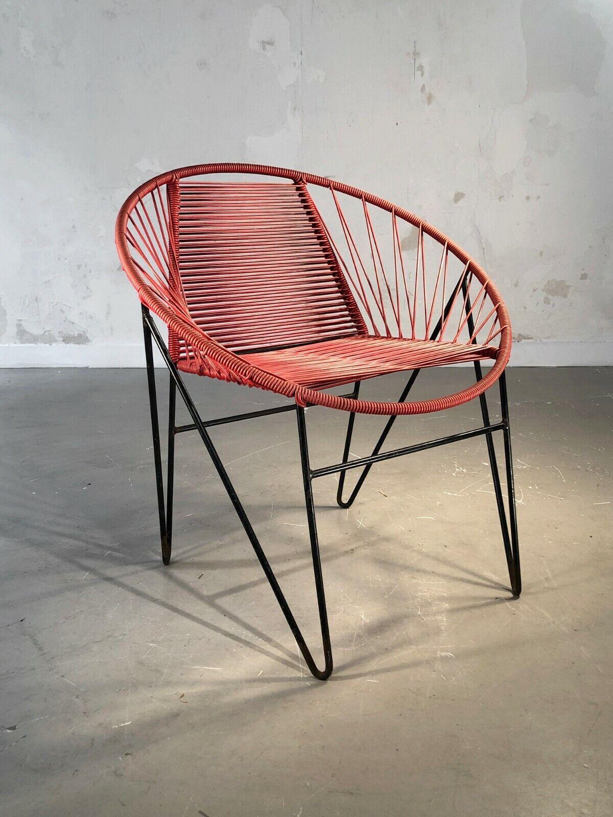 A very graphic chair with compass legs, Modernist, Free Form, Reconstruction, black lacquered metal compass legs, seat and back in red vinyl yarn composition, attributed to Raoul Guys, France 1950.