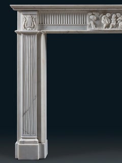 A Refined Neoclassical Chimneypiece Carved in White Statuary Marble