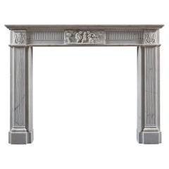 A Refined Neoclassical Chimneypiece Carved in White Statuary Marble