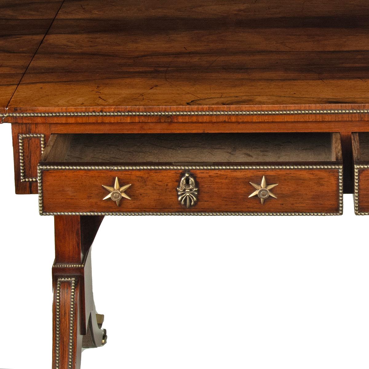 A Regency brass-inlaid rosewood sofa table attributed to Gillows For Sale 6