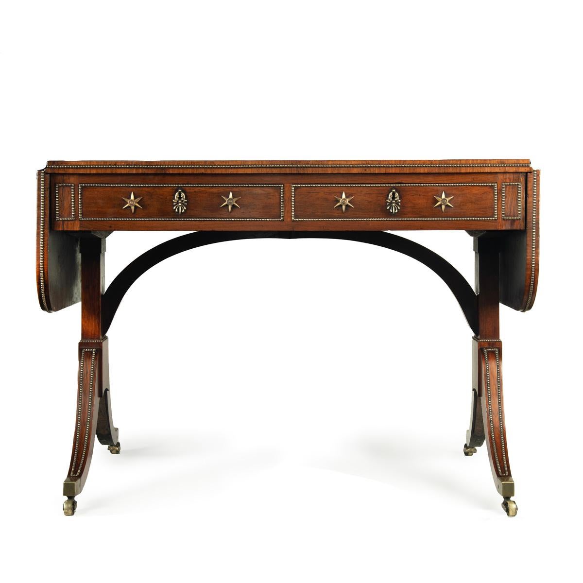 English A Regency brass-inlaid rosewood sofa table attributed to Gillows For Sale