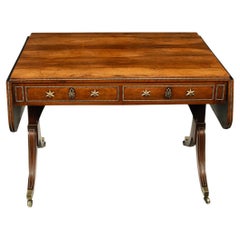 A Regency brass-inlaid rosewood sofa table attributed to Gillows