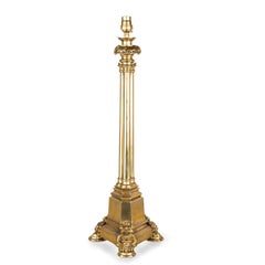 A Regency brass triple column table lamp