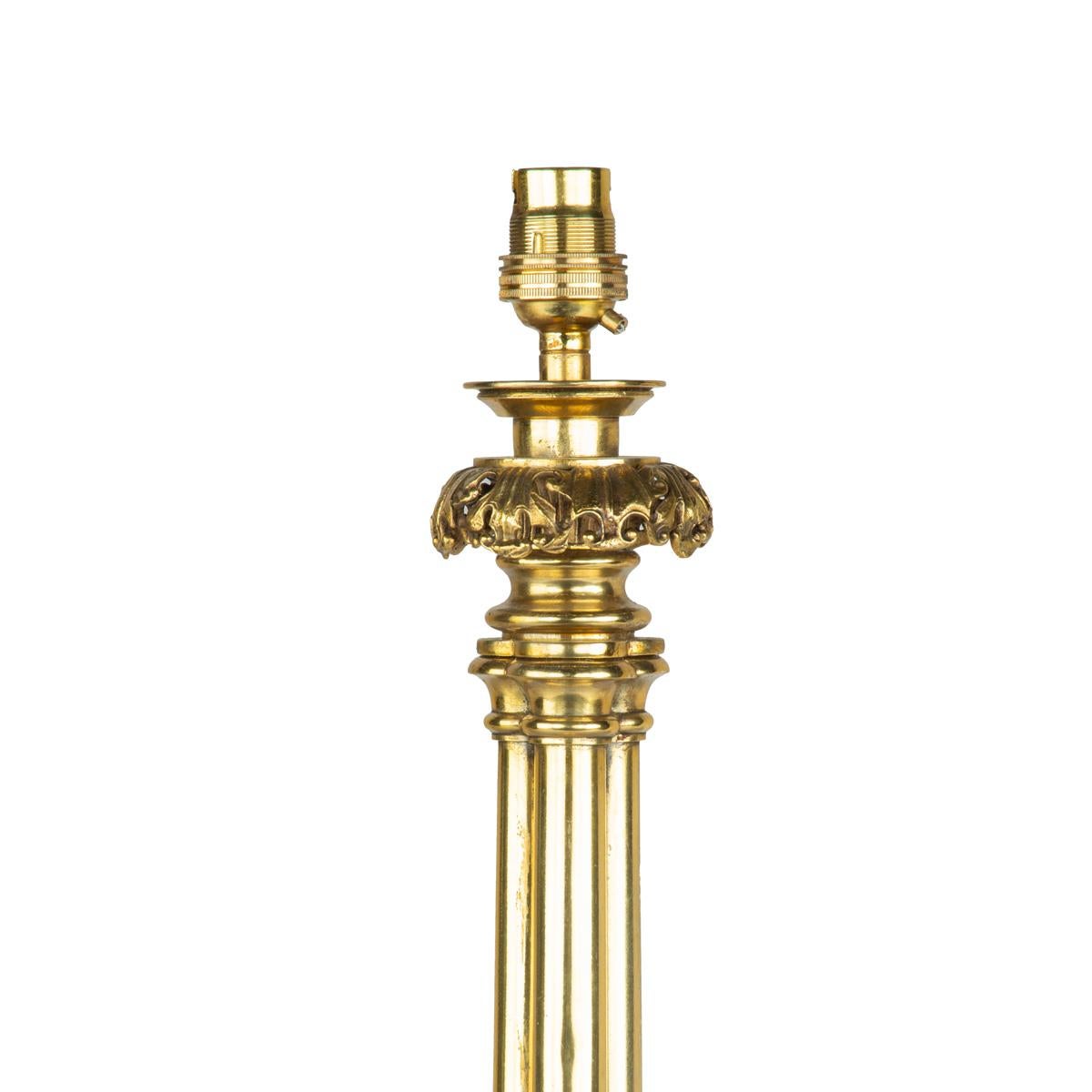 English A Regency brass triple column table lamp For Sale