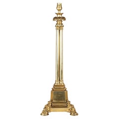 A Regency brass triple column table lamp