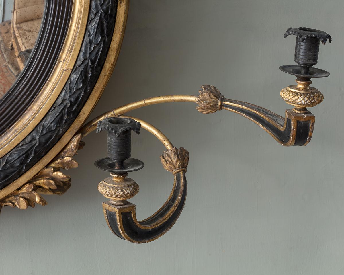 A Regency Giltwood and Ebonised Convex Mirror In Good Condition In London, GB